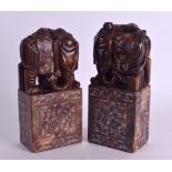 A PAIR OF LATE 19TH CENTURY CHINESE CARVED HARDSTONE SEALS formed as elephants standing upon