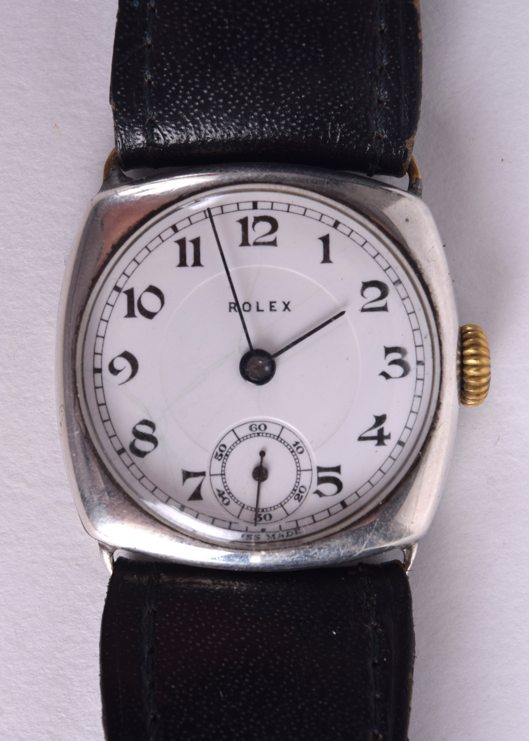 A VINTAGE GENTLEMANS SILVER AND ENAMEL ROLEX WRISTWATCH with circular dial and black painted