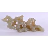 A 19TH CENTURY CHINESE CARVED MUTTON JADE BRUSH REST Qing, of naturalistic form. 13 cm x 5 cm.