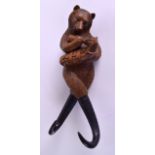 A RARE 19TH CENTURY BAVARIAN CARVED BLACK FOREST BEAR COAT HOOK unusually modelled feeding a young