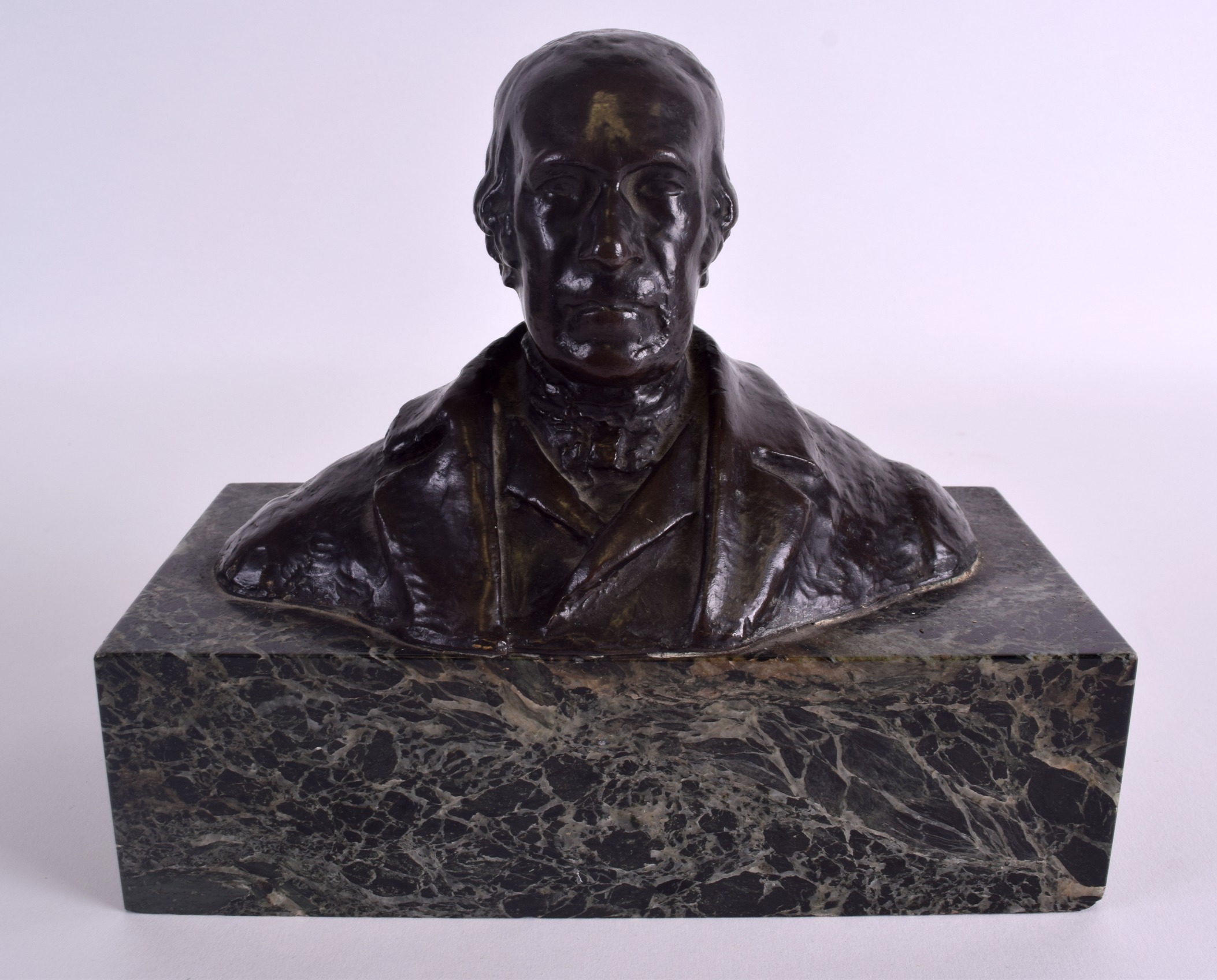 AN EARLY 20TH CENTURY SCOTTISH BUST OF A MALE possibly a composer, upon a green veined marble