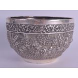 A 19TH CENTURY INDIAN SILVER EMBOSSED BUDDHISTIC BOWL decorated with figures, lions and