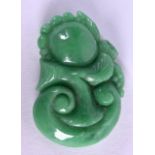 AN EARLY 20TH CENTURY CHINESE CARVED JADEITE AMULET in the form of a fruiting pod. 3 cm x 5.5 cm.