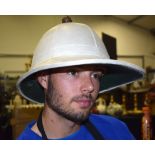 AN ANTIQUE WHITE MILITARY HELMET.