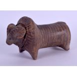 AN INDUS VALLEY POTTERY FIGURE OF A BEAST decorated with faint line decoration. 13 cm x 4 cm.