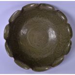 A CHINESE OLIVE GREEN SONG STYLE GLAZED BOWL, lobed in shaped and incised with foliage. 28 cm wide.