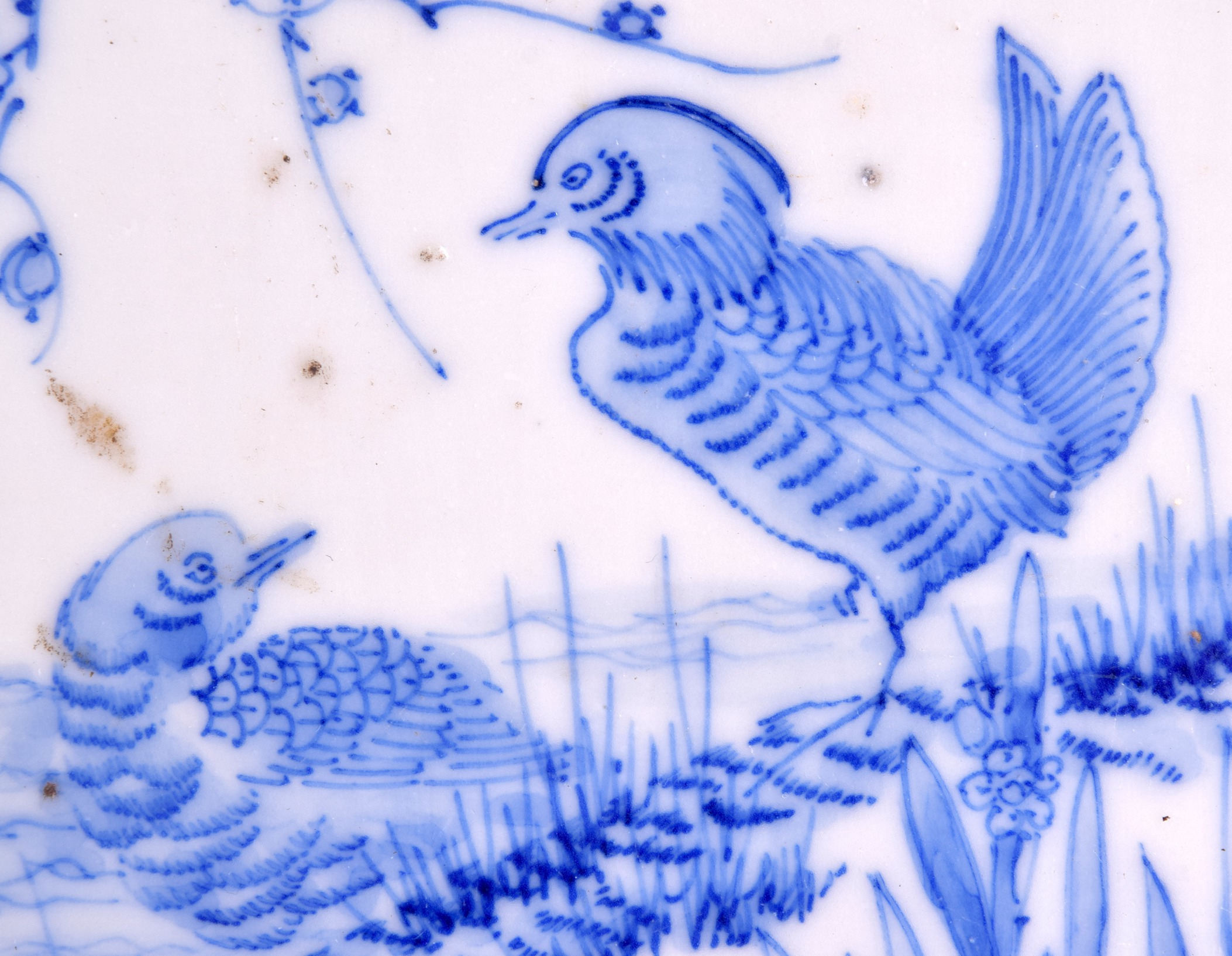 A SET OF THREE 19TH CENTURY JAPANESE BLUE AND WHITE TILES painted with game birds within landscapes. - Image 3 of 4