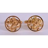 A PAIR OF EARLY 20TH CENTURY CHINESE 14CT GOLD CUFFLINKS decorated with dragons. 6.5 grams.