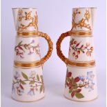 A PAIR OF 19TH CENTURY ROYAL WORCESTER BLUSH IVORY CLARET JUGS gilded and painted with floral