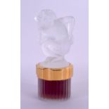 A FRENCH LALIQUE PERFUME GLASS SCENT BOTTLE AND STOPPER formed as a kneeling satyr. 18 cm high.