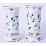 A PAIR OF DERBY STYLE PORCELAIN VASES, decorated with flowers. 10 cm high.
