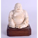 A LATE 19TH CENTURY CHINESE CARVED IVORY FIGURE OF A SEATED BUDDHA Qing, upon a fitted hardwood