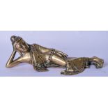 A 19TH CENTURY THAI BRONZE BUDDHA, modelled reclining with inlaid decoration. 22 cm wide.