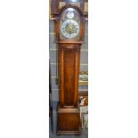 AN OAK GRANDMOTHER CLOCK, with brass dial. 170 cm high.