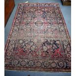 A GOOD 19TH CENTURY PERSIAN RED GROUND RUG, decorated wit extensive foliage and motifs. 214 cmx x