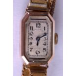 AN EARLY 20TH CENTURY 9CT GOLD LADIES WRISTWATCH with yellow metal strap. Overall 18.2 grams. Dial