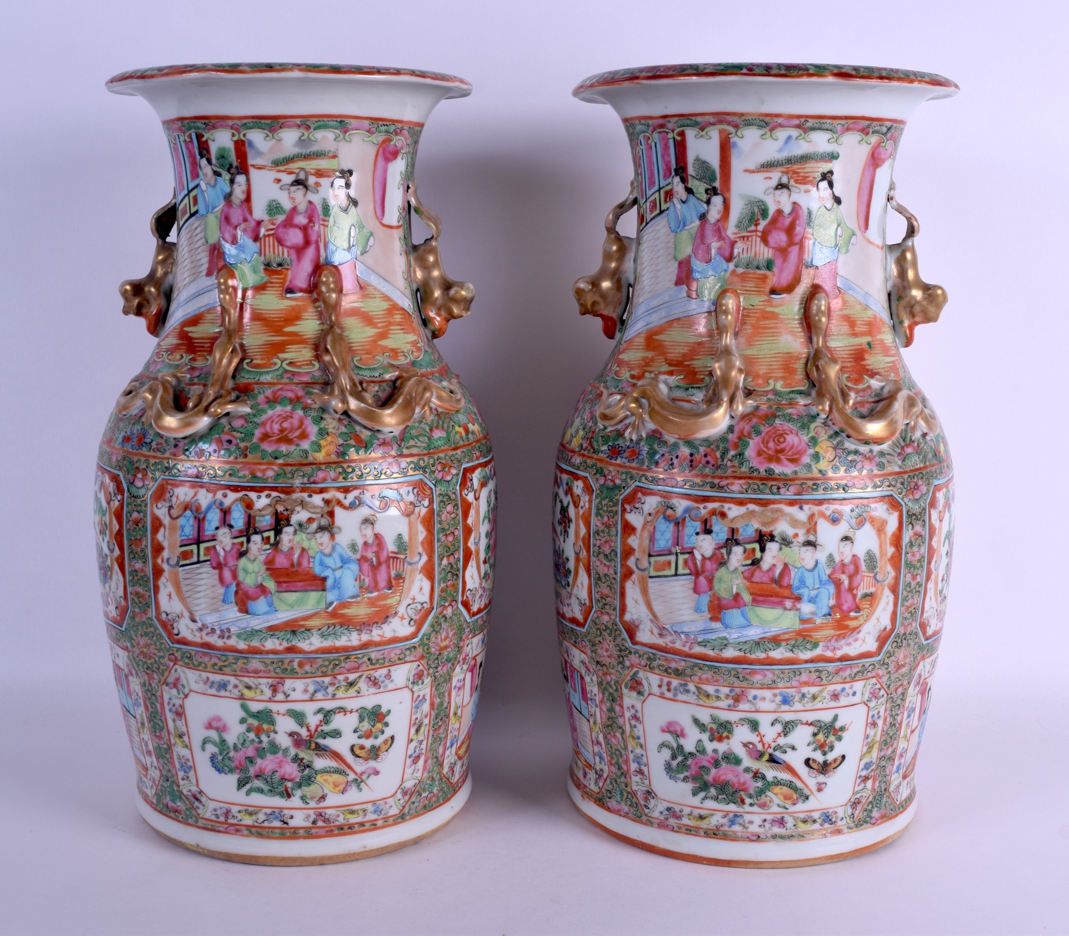 A LARGE PAIR OF 19TH CENTURY CHINESE CANTON FAMILLE ROSE VASES Qing, painted with figures and birds.