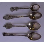 A GROUP OF FOUR SILVER SPOONS, of varying style. (4)
