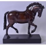 A 20TH CENTURY RESIN BRONZE EFFECT FIGURE OF A ROAMING HORSE, modelled upon a rectangular plinth. 25
