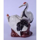 A JAPANESE FUKAGAWA SEIJI PORCELAIN FIGURAL GROUP, in the form of two cranes seated upon a rock.