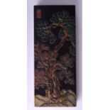 AN EARLY 20TH CENTURY CHINESE BLACK INKSTONE BLOCK decorated with trees and landscapes. 21 cm x 9