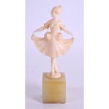 AN EARLY 20TH CENTURY FRENCH CARVED IVORY FIGURE OF A BALLERINA modelled holding her dress