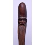 AN UNUSUAL 19TH CENTURY CHINESE CARVED HARDWOOD STAFF with figural terminal. 112 cm long.