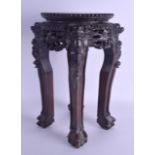 A 19TH CENTURY CHINESE HARDWOOD AND MARBLE INSET STAND decorated with mask heads. 36 cm x 24 cm.