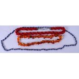 A THICK ROPE TWIST RED CORAL NECKLACE, together with an amber type necklace and another hardstone