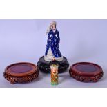 THREE CHINESE HARDWOOD STANDS, together with two porcelain figurines. (5)