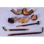 A COLLECTION OF VINTAGE PIPES, of varying subject, together with three opium pipes.(6)