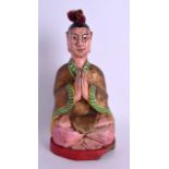 AN EARLY 20TH CENTURY CHINESE POLYCHROMED WOOD FIGURE OF A SEATED MALE modelled with hands