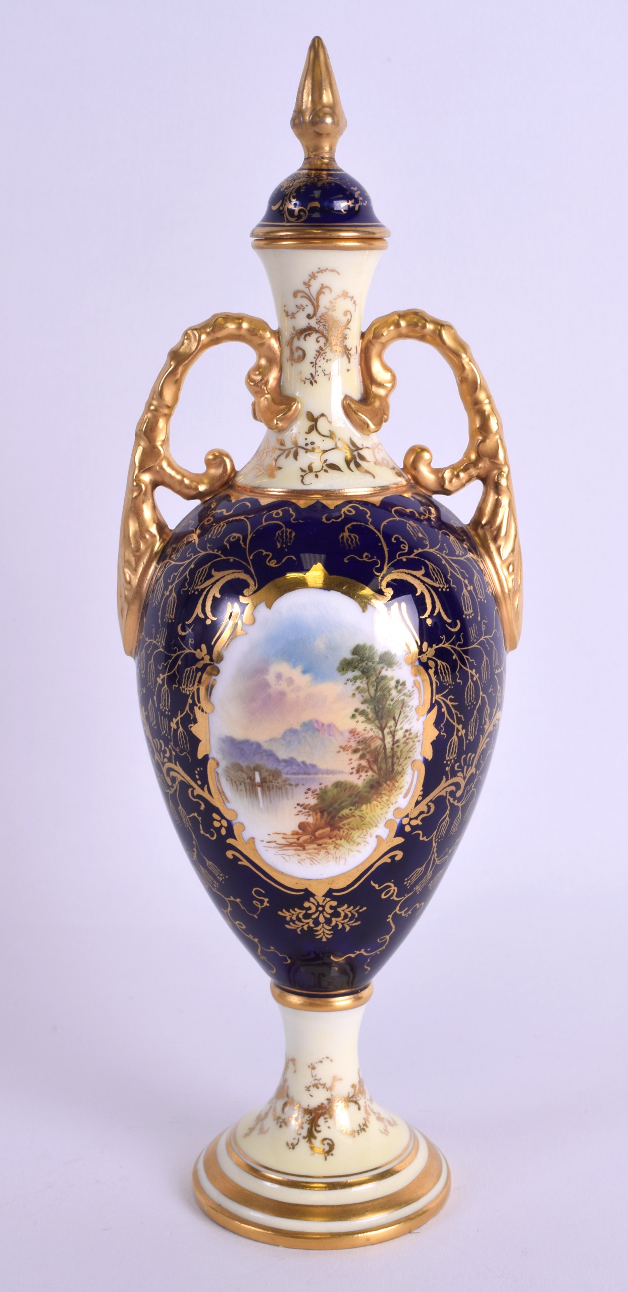 AN EARLY 20TH CENTURY COALPORT TWIN HANDLED VASE AND COVER painted with a view of Ben Lomond. 25