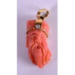 AN UNUSUAL 18CT GOLD CORAL AND DIAMOND PENDANT in the form of a Chinese male. 1.25 cm x 3 cm.