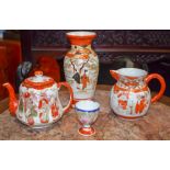 A JAPANESE MEIJI PERIOD KUTANI PORCELAIN VASE, together with a jug, tea pot and an egg cup. Vase