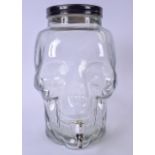 A HUGE GLASS DRINK DISPENSER IN THE FORM OF A SKULL, the tap connected at the mouth. 34 cm x 21 cm.
