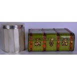 A CYLINDRICAL MOTHER OF PEARL POT, together with a miniature tin trunk. Trunk 14 cm wide.