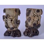 A PAIR OF EARLY 20TH CENTURY CHINESE SOAPSTONE BRUSH POTS, carved in relief with foliage on