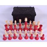 A GOOD 19TH CENTURY JACQUES STAUNTON IVORY CHESS SET within a Carton-Pierre casket, decorated with
