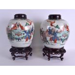 A PAIR OF 19TH CENTURY CHINESE FAMILLE VERTE GINGER JARS AND COVERS Kangxi style, painted with