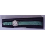 A MERCEDES BENZ WRISTWATCH, chrome dial and green cloth strap.