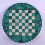 A 19TH CENTURY CONTINENTAL CARVED MALACHITE AND MARBLE CHESS BOARD. 24 cm diameter.