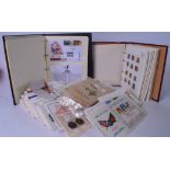 TWO STAMP ALBUMS, together with a large quantity of first day covers. (qty)