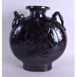AN UNUSUAL LARGE 19TH CENTURY CHINESE BROWN GLAZED POTTERY EWER decorated with a large central