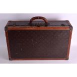 A VINTAGE LOUIS VUITTON SUITCASE with internal label No. 822117. 60 cm x 37 cm.