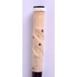 A 19TH CENTURY CARVED IVORY AND HARDWOOD SHELL INLAID WALKING CANE with horn terminal. 81 cm long.