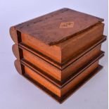 AN EARLY 20TH CENTURY OAK CIGARETTE BOX OR SMOKERS COMPENDIUM, carved in the form of a stack of