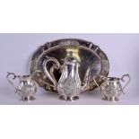 A GOOD EARLY 20TH CENTURY THAI FOUR PIECE SILVER SIAM TEASET decorated with Buddhistic figures in