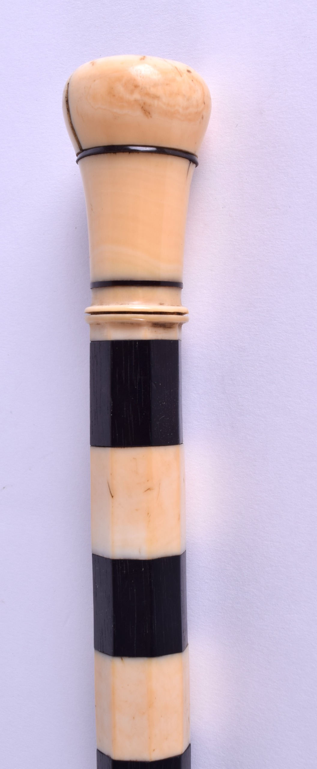 A MID 19TH CENTURY CARVED IVORY EBONY AND BONE WALKING CANE. 85 cm long. - Image 2 of 3