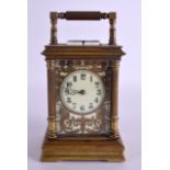 A LARGE 19TH CENTURY FRENCH BRASS REPEATING CARRIAGE CLOCK with open work brass dial decorated